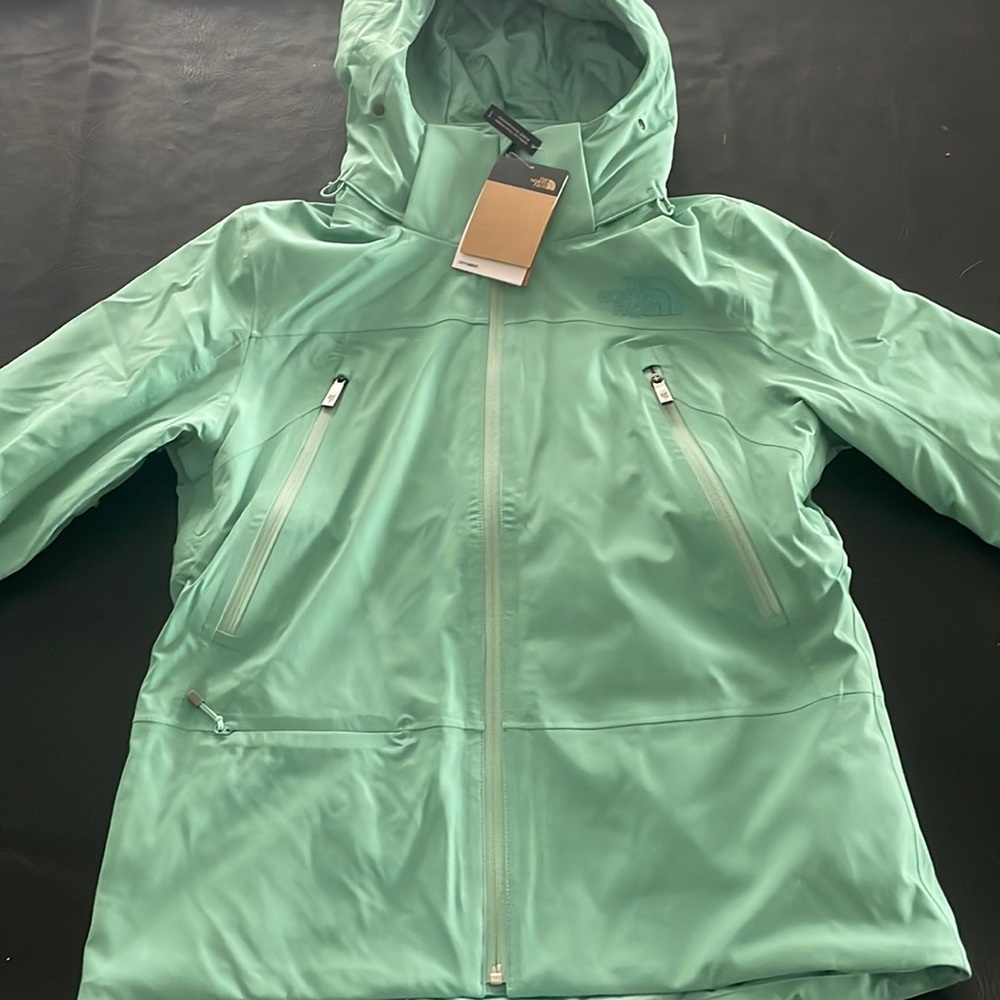 Brand new women’s North Face snowboarding jacket. Color, teal.